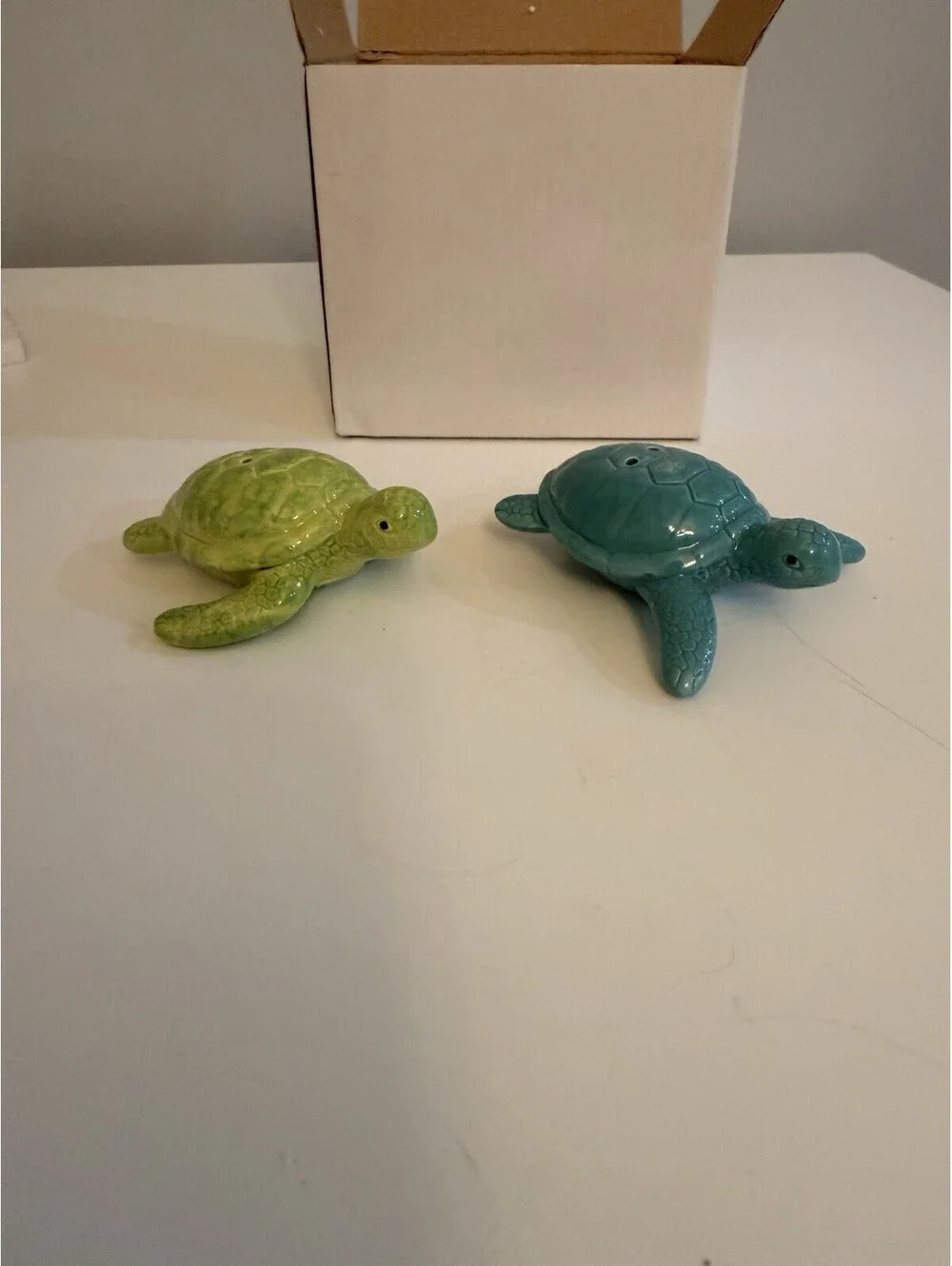 Cape Shore add a touch of ocean charm to your dining experience with the cape shore ceramic turtles salt & pepper set  colored in serene blue and green